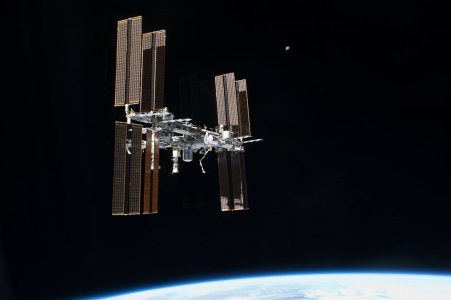 The international space station in orbit around the earth.