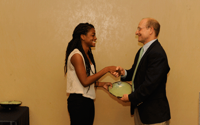 Photo of Alexis Harrison as she receives her award from Office of Sustainability Director, Mike Kensler.