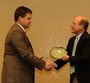Photo of Award recipient Judd Langham receives his award from Mike Kensler, <a href=