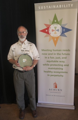 Photo of Dr. Dennis DeVries with his Spirit of Sustainability Award.