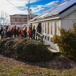 Photo of Students touring the solar house.