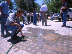 Photo of McWhorter School of Building Science testing and demonstrating pervious pavement.