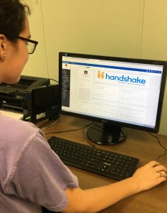Photo of student using the Handshake job platform.