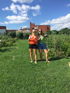 Kenzley and Ginny help out in an urban garden during the DC Central Kitchen Boot Camp