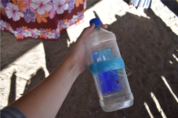 A water bottle with fishing line to be used for fishing Photo credit: Haley Turner
