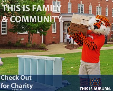 A photo of Aubie carrying boxes.