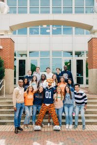 Photo of members of Student Involvement with Aubie in front of the Melton Student Center
