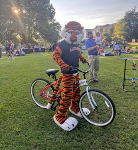 Image of Aubie on a bicycle 