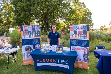 Student smiling at the table for Auburn Rec and Wellness