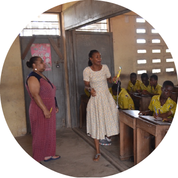 Image of two woman teaching to students