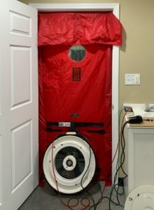 Photo of a door with blower equipment covering the whole door frame 
