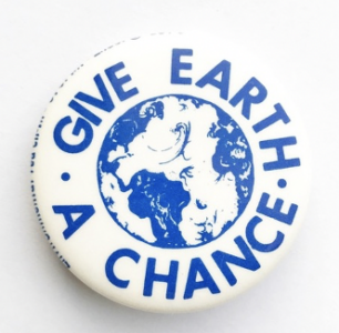 "give earth a chance" text written in blue on a white button