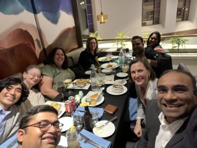 A group of people sitting around a table eating.