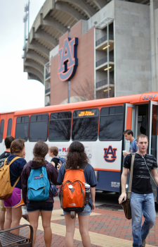 Students waiting and riding Tiger Transit