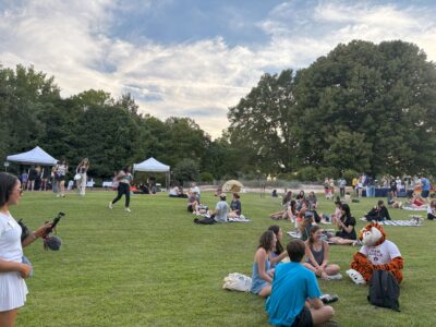 Photo of picnic goers enjoying food and friends.