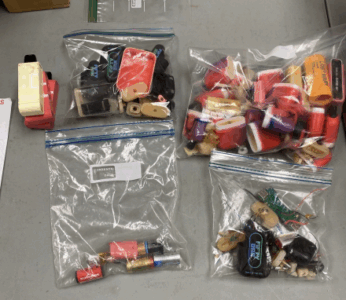 four plastic bags filled with vape pen batteries to recycle