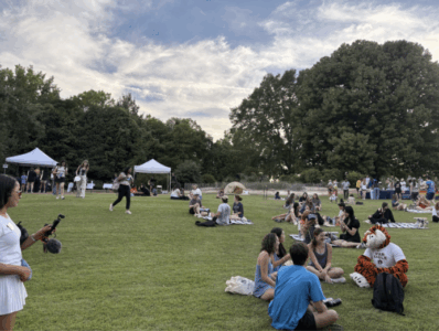 groups of students enjoying the sustainability picnic on the lawn of the davis arboretum