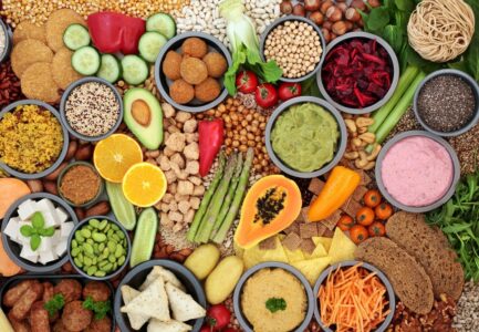 a spread of a variety of healthy fruits, vegetables, and grains