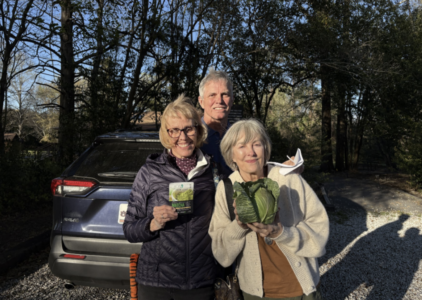 3 OLLI members hold up their valuable prizes of cabbage and matcha! 