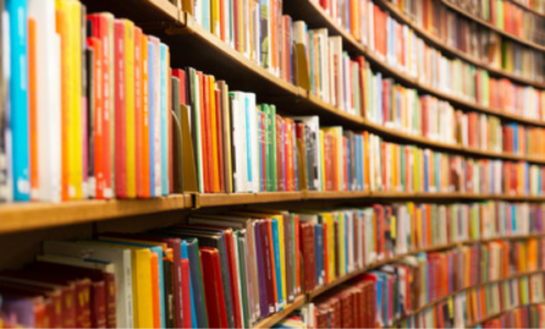 a range of books on shelf at a library