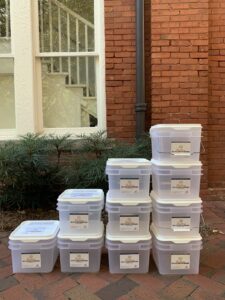stacks of battery recycling buckets